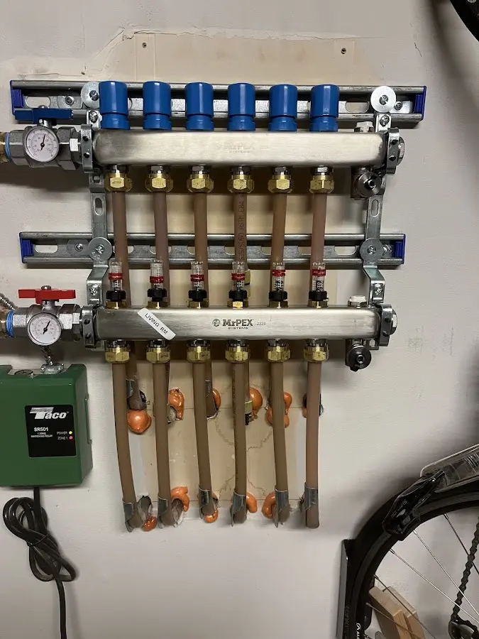 Plumber performing Water Heater Repair at a residential property in Pine Creek